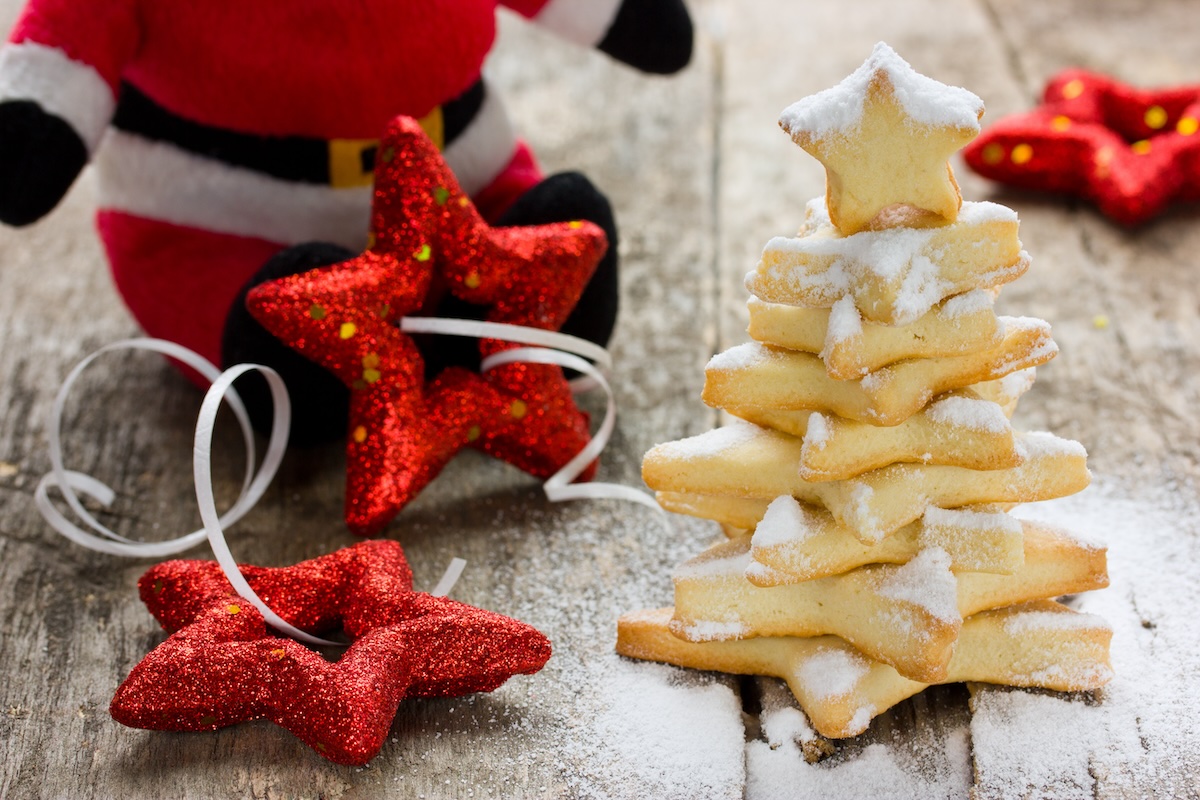 Homemade gingerbread cookies christmas tree decorated icing on wooden background