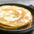 Stack of pancakes on a cast-iron frying pan. Rustic. Shallow DOF