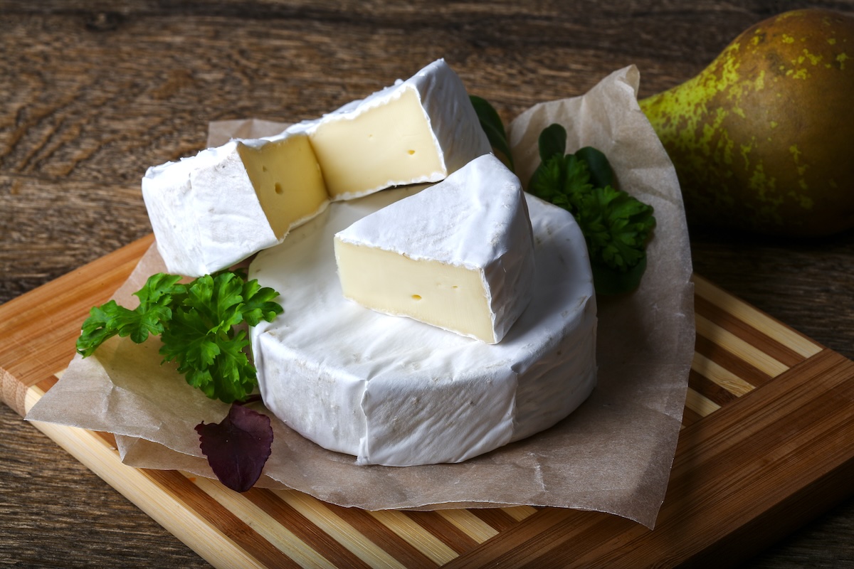 Camembert cheese with parsley and salad leaves