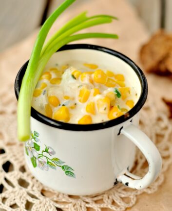 Thick and creamy corn chowder with potatoes and greens