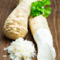 Two,Horseradish,Roots,On,A,Wooden,Board