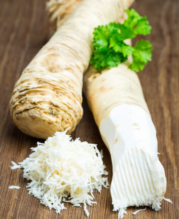 Two,Horseradish,Roots,On,A,Wooden,Board
