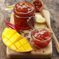 Jar of Mango Chutney on old wooden table
