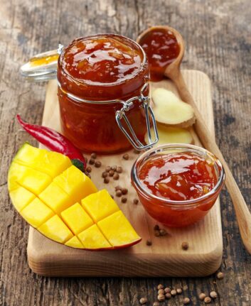 Jar of Mango Chutney on old wooden table